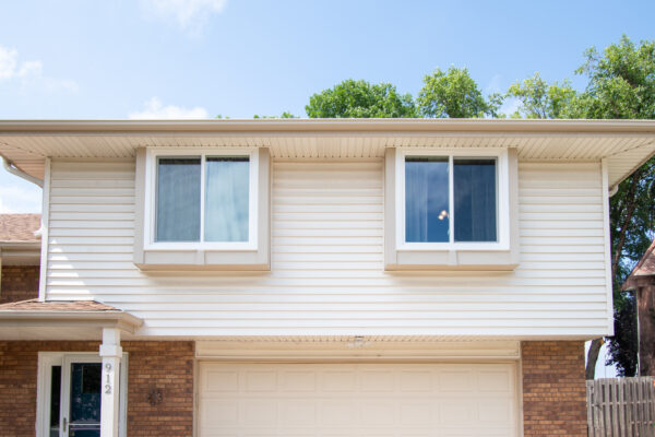 White vinyl sliding 2nd story window