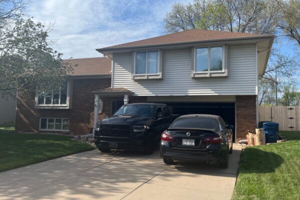 Front of house before Pella replacement windows