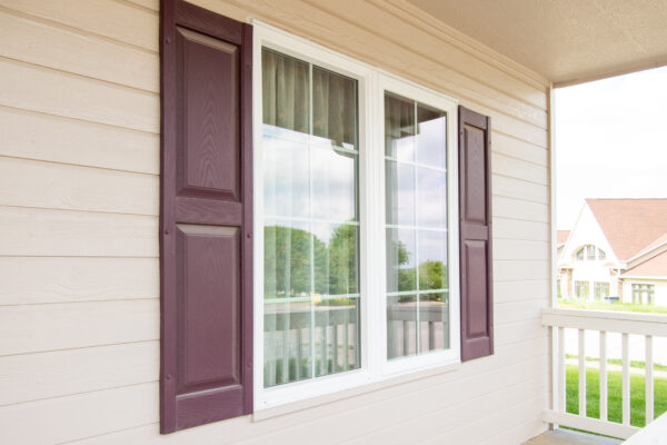 Pella vinyl window with grilles between the glass