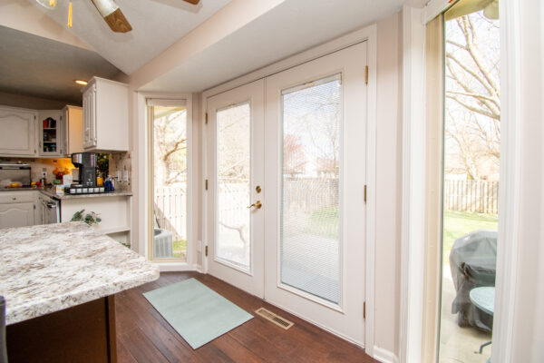 Vinyl fixed windows beside patio door