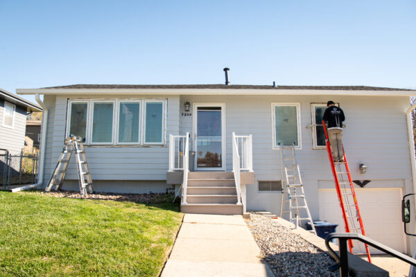 White casement windows on front of house