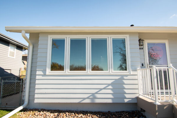 4 wide casement windows on front of house