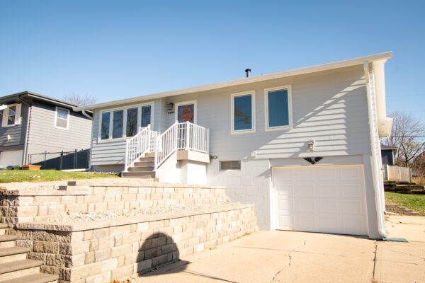 White casement windows on front of house